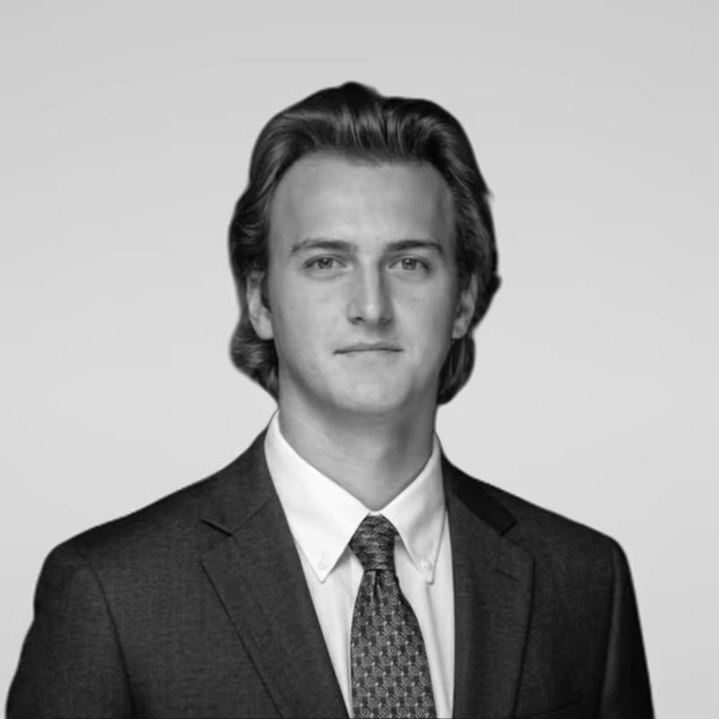 Black and white portrait of Joe Kleve on a light gray studio background.